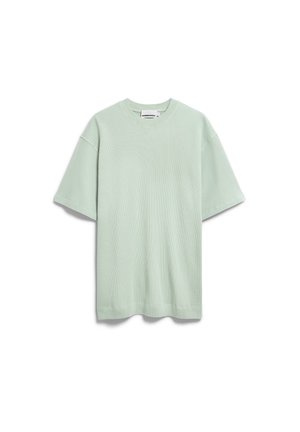 Hellgrünes T-Shirt aus Waffelstrick mit kurzen Ärmeln, Rundhalsausschnitt, lockerer Passform und sichtbarem Markenetikett im Kragen.