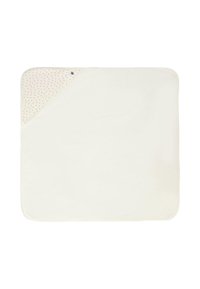 Coperta morbida color crema con una texture liscia. Un angolo presenta un design a motivo bianco con piccoli punti rossi.