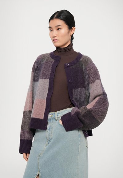 Knit cardigan with a multicolored patchwork design in shades of purple and gray. Rounded neckline, button front, and ribbed cuffs.