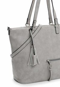 Gray faux leather tote bag with two straps, a decorative tassel, and a front zippered pocket. Smooth texture with minimal accent details.