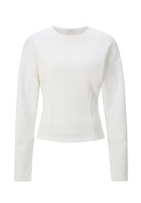 Valge pika varrukaga särk, tehtud siledast kangast, omab ümmargust kaelust, keha järgivat lõiget ja varrukatel õmbluste detaili.