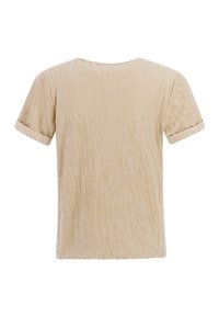 Top beige de manga corta con un patrón de ondas texturizadas, cuello redondo y puños doblados. Tejido suave con un brillo sutil.