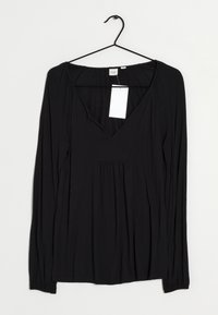 Black long-sleeve top with a deep V-neck, made of soft fabric. Features gathered detail below the neckline and a straight hem. Tag attached.