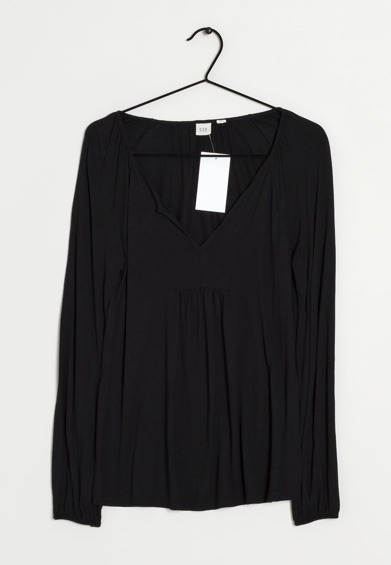 Black long-sleeve top with a deep V-neck, made of soft fabric. Features gathered detail below the neckline and a straight hem. Tag attached.