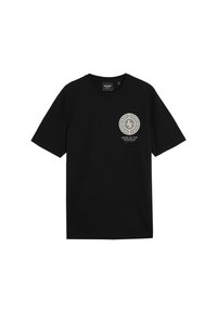 T-shirt en coton noir avec des manches courtes et un col rond, arborant un motif circulaire en détail doré sur la poitrine.