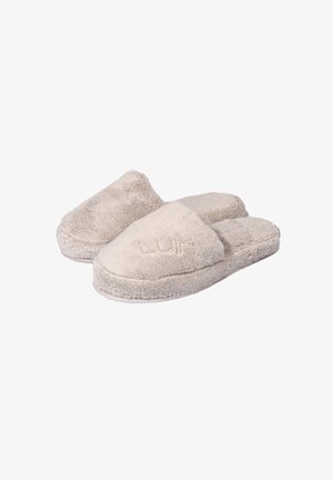 Beige, flauschige Hausschuhe mit einer weichen Textur, offener Ferse und abgerundeter Zehenform. Mit gesticktem Logo auf der Vorderseite.