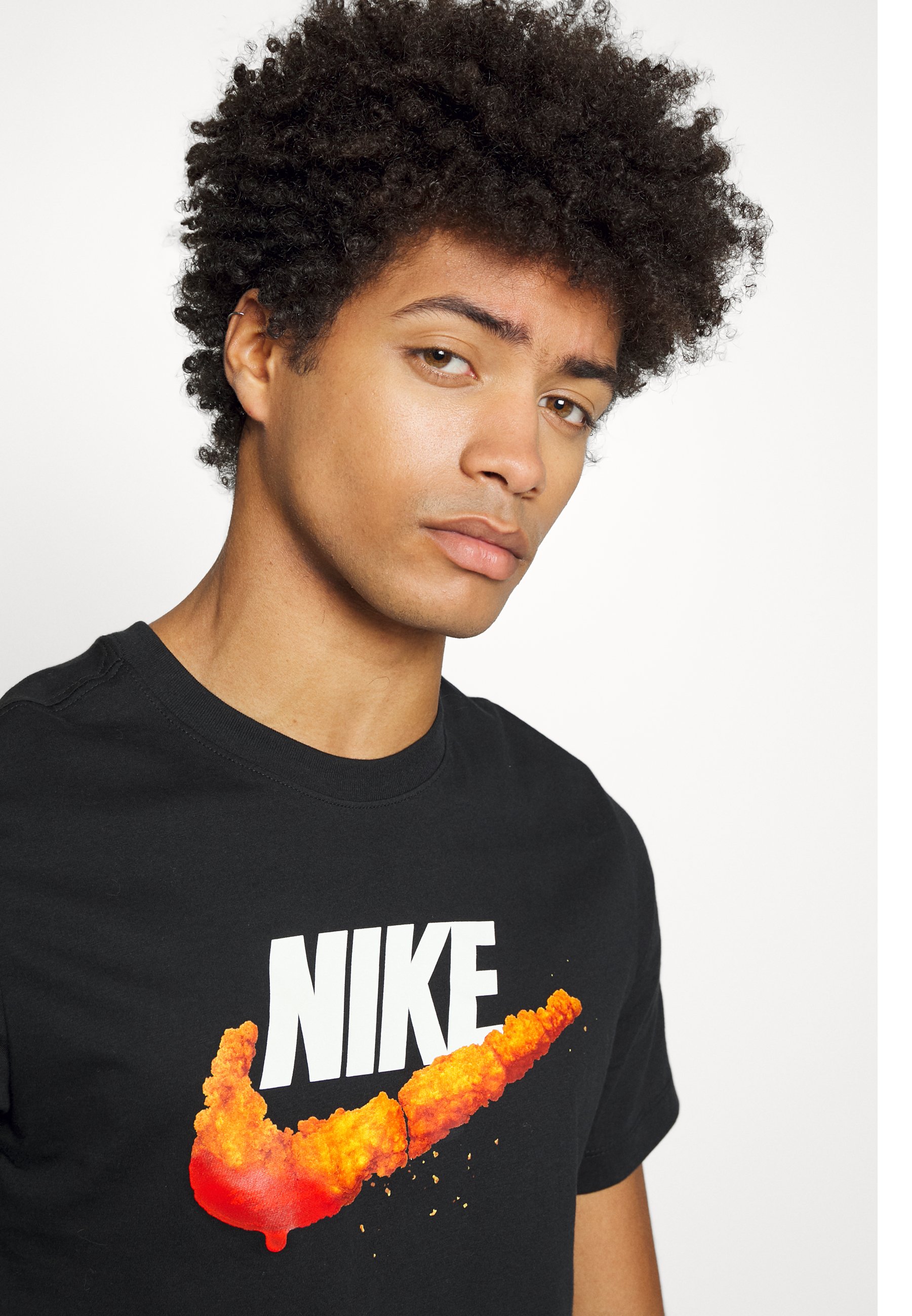 yellow and red nike shirt