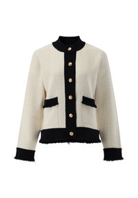 Cremfarbene und schwarze gewebte Jacke mit strukturiertem Finish, ausgestattet mit einem runden Kragen, goldenen Knopfverschlüssen auf der Vorderseite und zwei kontrastierenden Taschen.