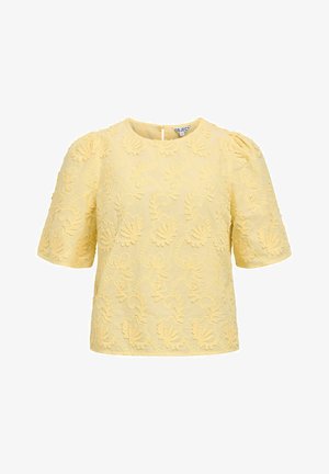Blouse jaune à manches courtes avec broderie florale et col rond, dotée de manches bouffantes et d'une fermeture à boutons au dos.