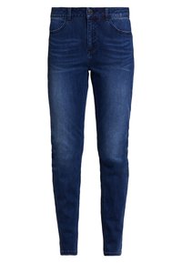 Jeans ajustados azul oscuro con cinco bolsillos, cierre frontal de botón y cremallera, que presentan un ligero desgastado en los muslos y en las rodillas.