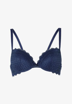 Reggiseno in pizzo blu navy con bordi scallopati, spalline regolabili e un piccolo fiocco al centro davanti.