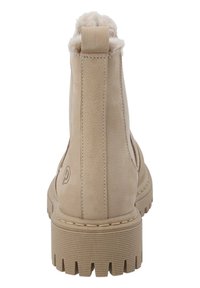 Botas de tobillo beige con un upper de cuero texturizado, un borde de piel sintética en el cuello y una suela de goma estriada para mayor tracción.