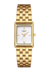 Kvadrāta formas zelta pulkstenis ar teksturētu sudraba ciparnīcu, zelta marķieriem un rakstainu metāla siksniņu. Zīmola nosaukums izcili izcelts.