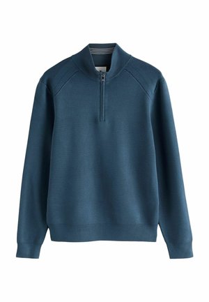 Pull-over zippé bleu en tricot fabriqué dans un tissu doux. Présente un col et des poignets côtelés, avec une texture simple et lisse.