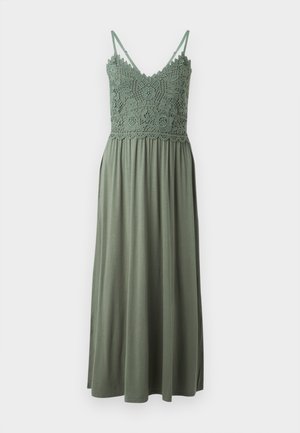 Green maxi dress featuring a crochet bodice and spaghetti straps, with a flowing lower half made of soft, lightweight fabric.