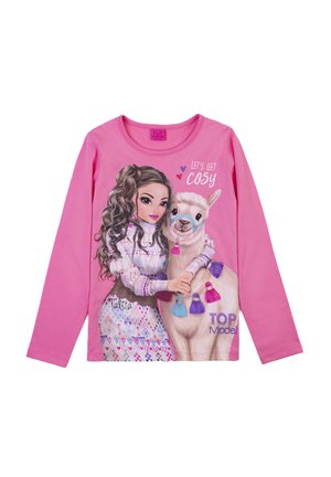 Maglietta a maniche lunghe rosa con una grafica di una ragazza dai capelli castani e un lama, decorata con frange colorate e il testo "LET'S GET COSY."