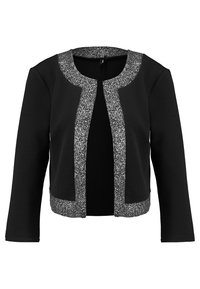 Svart jacka med en texturerad silverkant runt halsringningen och framdelen. Mjuk tyg med långa ärmar och design med öppen front.