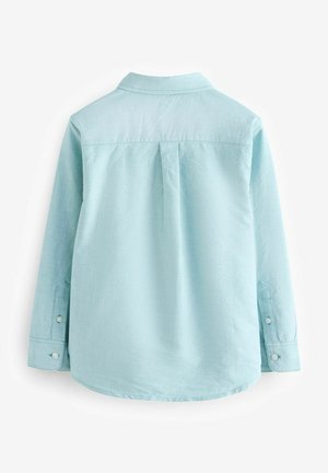 Lichtblauw langarmshirt, van katoenmix, met een rugpas, plooi en afgeronde onderkant. Knopmanchetten met enkelvoudige knoopsluiting.