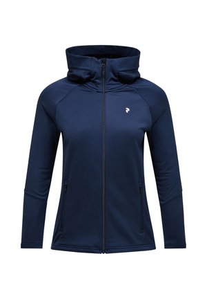 Veste zippée bleu marine en tissu doux et extensible. Présente un col haut, des manches longues et deux poches latérales. Design léger.