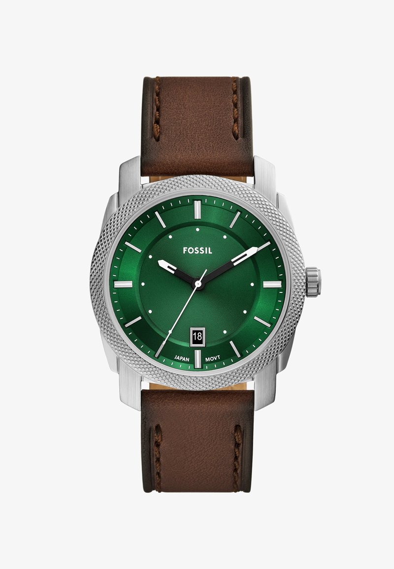Green dial watch with silver case and brown leather strap, featuring a date display, textured bezel, and white hour markers.