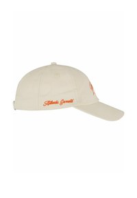 Beige színű baseball sapka pamutból, ívelt karimával. Oldalán és hátulján narancssárga hímzett felirattal rendelkezik. Hátul állítható pánt található.
