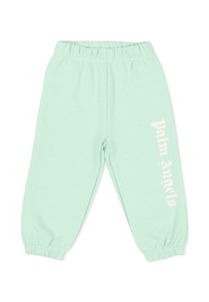 Pantaloni della tuta verde menta con vita e polsini elastici, con la scritta bianca "Palm Angels" stampata verticalmente sulla gamba destra.