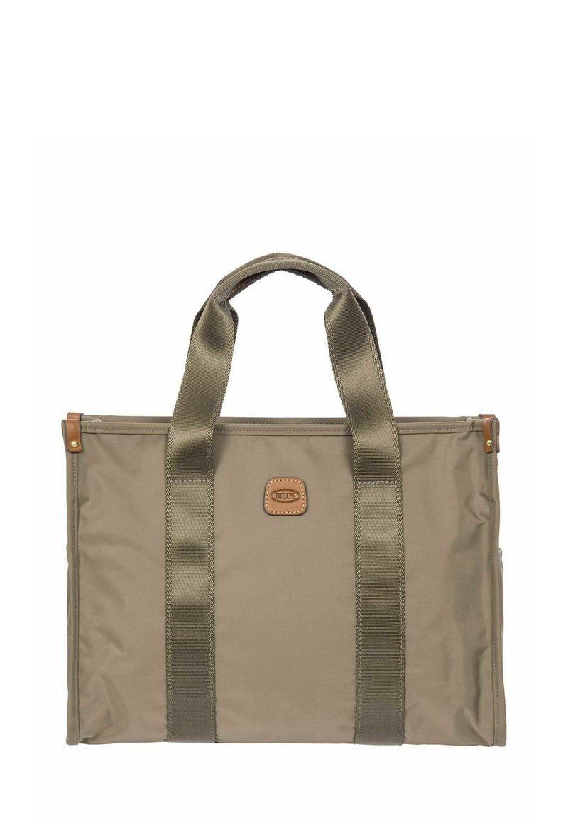Sac fourre-tout rectangulaire beige avec des poignées vert olive et un petit patch en cuir centré sur le devant.