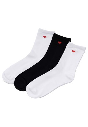 Trzy stopki, dwie białe i jedna czarna, każda z małym czerwonym serduszkiem blisko górnej krawędzi.