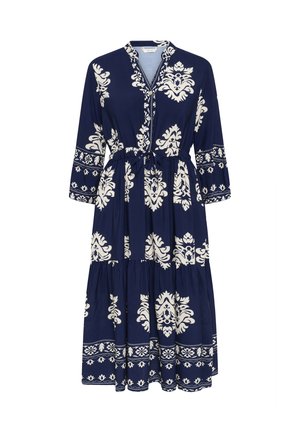 Rochie maxi bleu marin cu modele florale albe, având guler, mâneci trei sferturi, talie strânsă și fustă cu volane.