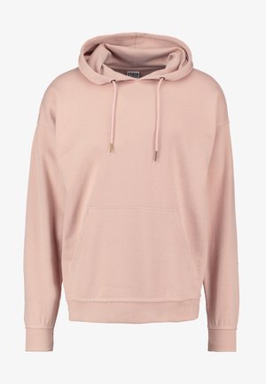 Różowa bluza z kapturem wykonana z miękkiego materiału, z kangurzą kieszenią, sznurkami z złotymi akcentami oraz ściągaczami u rękawów i na dole.