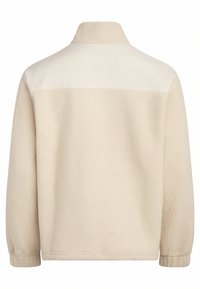 Κρεμ jacket φλις με μακριά μανίκια, ελαστικές μανσέτες και στερεό ύφασμα στο επάνω μέρος της πλάτης.