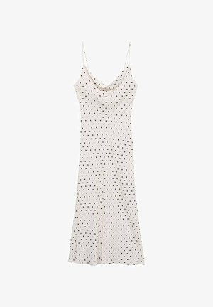 Šaty bez rukávov z jemného, ľahkého materiálu; krémové pozadie s čiernymi bodkami; zavinovací výstrih a voľný strih.