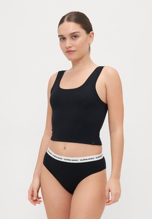 Black tank top with wide straps and a straight neckline, paired with black hipster underwear featuring a white elastic band with "BJÖRN BORG" text.
