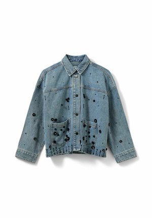 Denim jacket with a light blue finish, featuring black floral beading, two front pockets, and a button-up closure, with long sleeves.