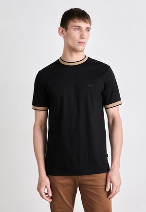 Black cotton T-shirt with round neckline, beige trim on collar and sleeves, featuring a subtle "BOSS" logo on the chest.