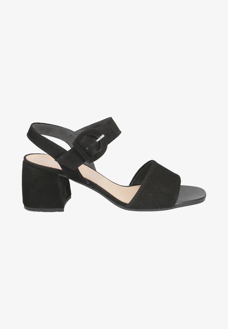 Sandale noire en daim à bout ouvert avec un petit talon bloc et une bride cheville avec une grande boucle ronde.