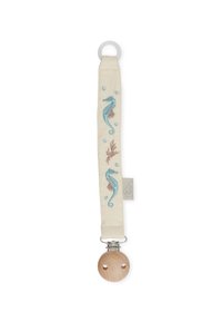 Paci strap featuring a cream fabric with blue embroidered seahorses and bubbles, attached to a wooden pacifier with a silver clip.