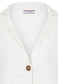 Crème geklede cardigan met een ruitpatroon, voorzien van een geknipt kraag en een bruine knoop aan de voorkant, gelabeld "FELIX HARDY."