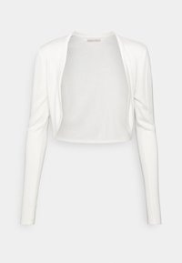 Cardigan blanc court à manches longues, fabriqué dans un tissu doux et léger. Présente un design à ouverture frontale et des détails de couture minimalistes.