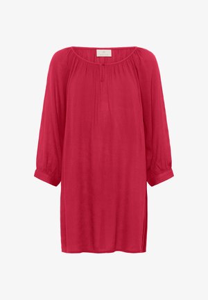 Raudona, lengva palaidinė su ilgomis, susiraukšlėjusiomis rankovėmis ir apvaliu iškirpimu. Textūruotas audinys su švelniu kritimu. Nėra matomų užsegimų ar raštų.