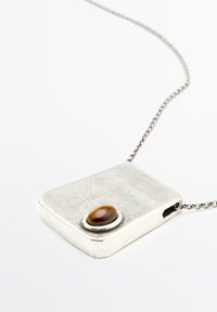 Silver rectangular pendant with a smooth, polished surface, featuring a brown oval stone set in a silver bezel on one side. Chain included.