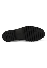 Semelle de chaussure en caoutchouc noir avec un motif de bande de roulement texturé, présentant des rainures horizontales et verticales pour l'adhérence et la durabilité. Nom de la marque "Gabor" visible.