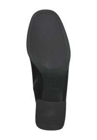 Semelle de chaussure noire avec une semelle en caoutchouc texturée au motif en zigzag et un léger talon. Comprend un logo sur la zone du talon.