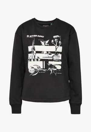 Musta puuvillainen collegepaita, jossa valkoinen kasvi- ja kukkakuva ja pyöreä pääntie, pitkät hihat sekä resorit hihansuissa.