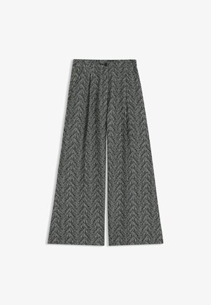 Wide-leg trousers in a black and white herringbone pattern, featuring pleats, a high waist, and a smooth fabric texture.