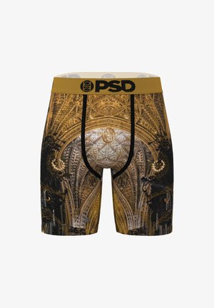 Boxers pour hommes en or et noir avec un design architectural orné, présentant une ceinture noire avec le logo PSD et des détails texturés.