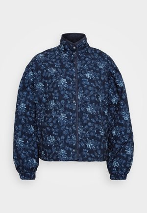 Tikkeline tumesinine jakk, millel on helesinine lillemuster. Omab kõrget kraed ja nööpe, elastseid mansette ning lühikest disaini.