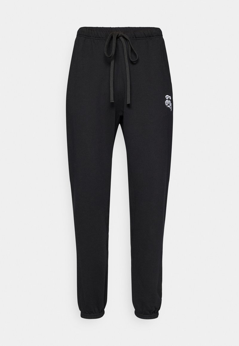 Schwarze Sweatpants mit Kordelzug, elastischen Bündchen und kleinem weißen Grafiklogo oberhalb des linken Oberschenkels.