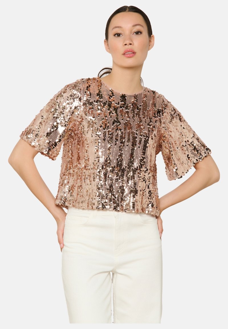 Rose gold sequin top with a round neckline and short sleeves, featuring a loose fit and a shiny, textured surface.