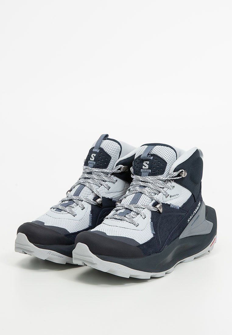 Mittelhohe Wanderschuhe mit einem grau-blauen Design, aus Mesh- und Textilmaterialien, einer strukturierten Sohle und gemusterten Schnürsenkeln.